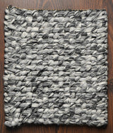 Grey mixture loop chunky wool rug texture close-up