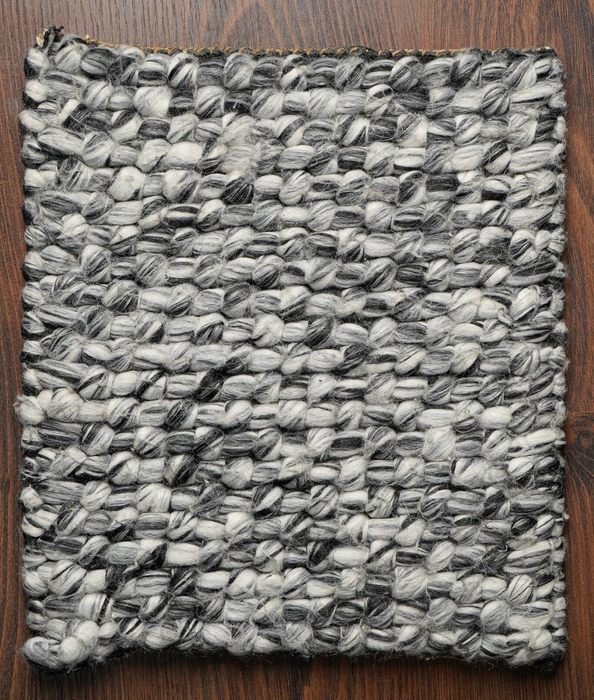 Grey mixture loop chunky wool rug texture close-up