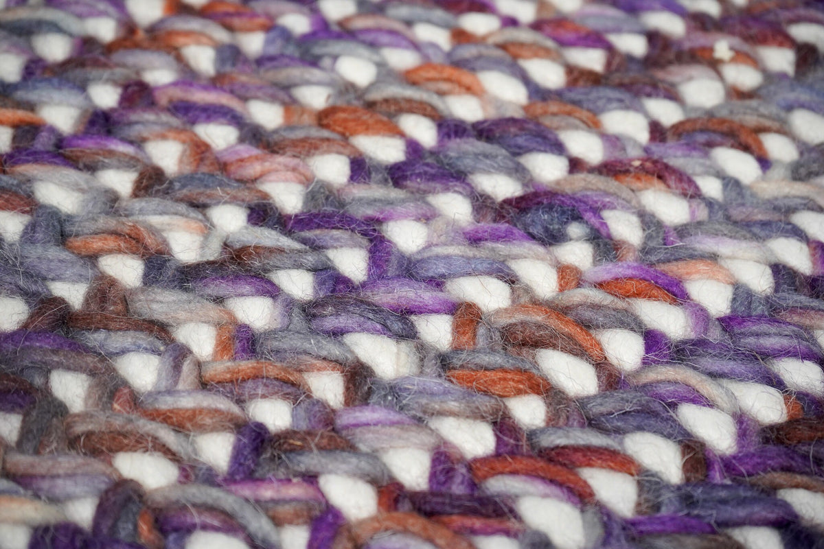 Purple wool rug corner detail showing weave