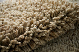 Shaggy wool rug placed in bedroom setting