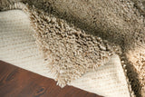 Beige rug under coffee table in living space