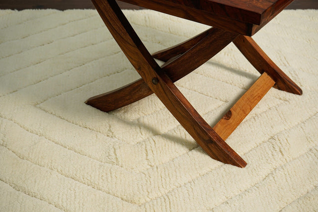 Ivory abstract rug styled in a Scandinavian living room