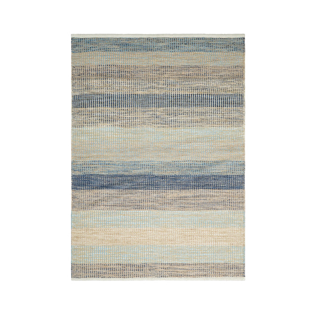 Blue striped rug styled in modern living room