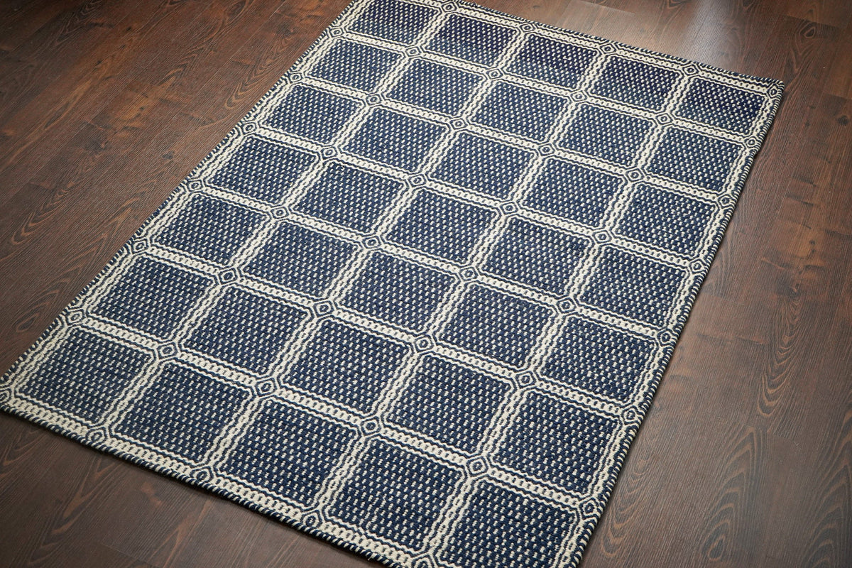 Overhead view of blue geometric wool rug