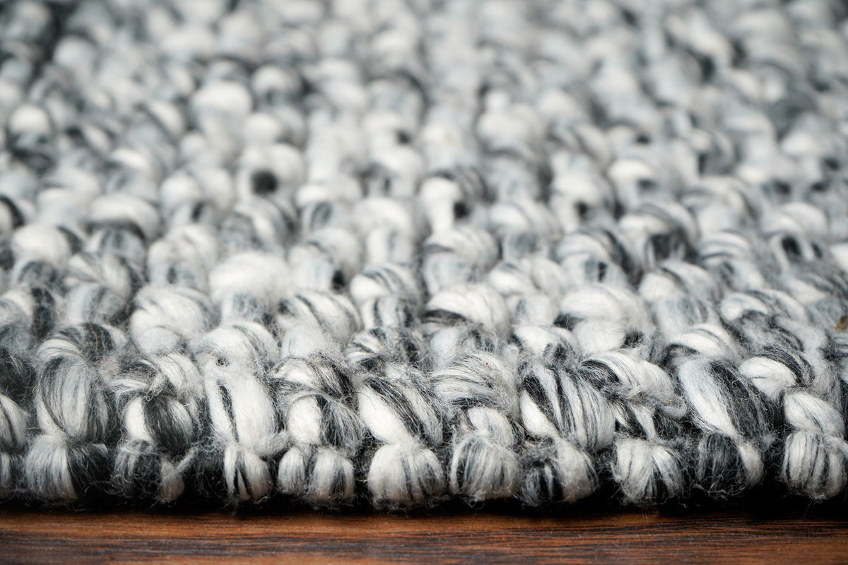 Grey mixture loop chunky wool rug weave close-up