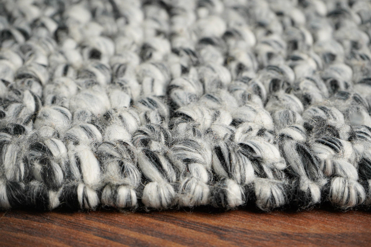 Grey mixture loop chunky wool rug pile detail