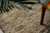Shaggy wool rug styled in Scandinavian living room