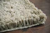 Full flat lay of beige shaggy wool rug
