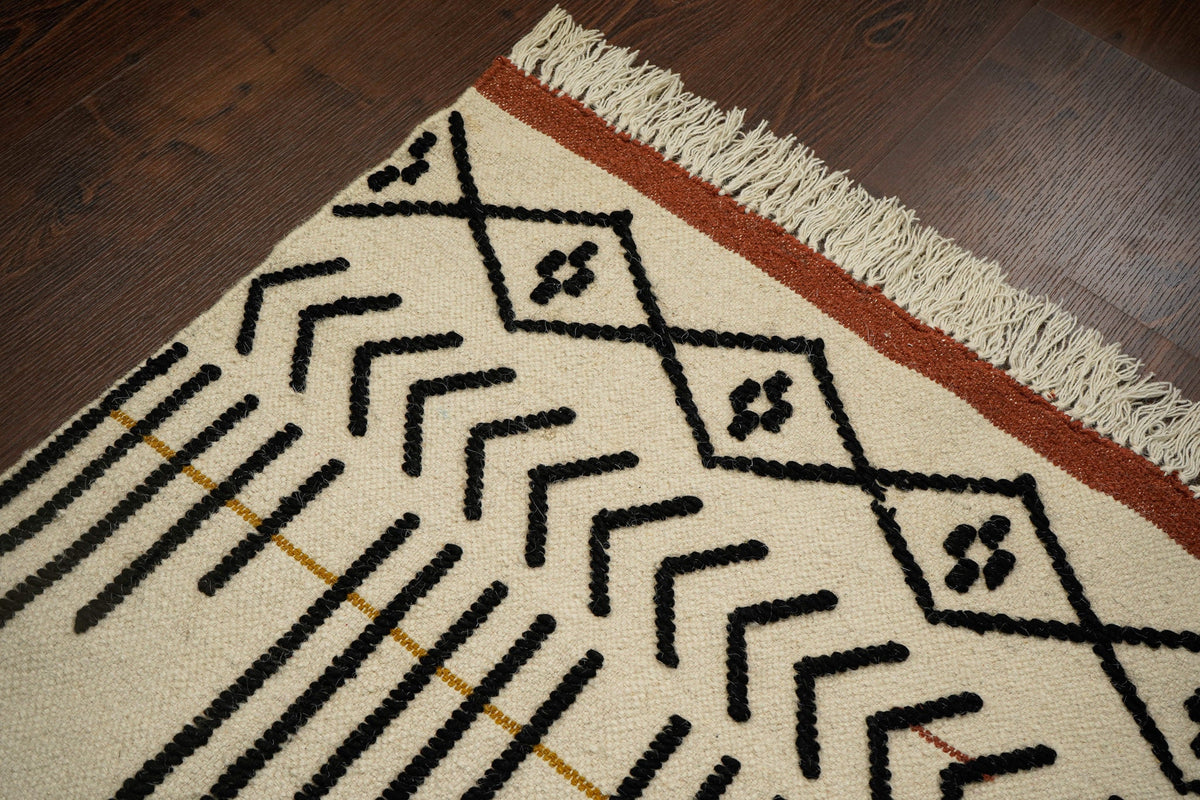 Ivory abstract rug styled with minimalist furniture