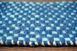 Close-up of blue chunky looped wool texture