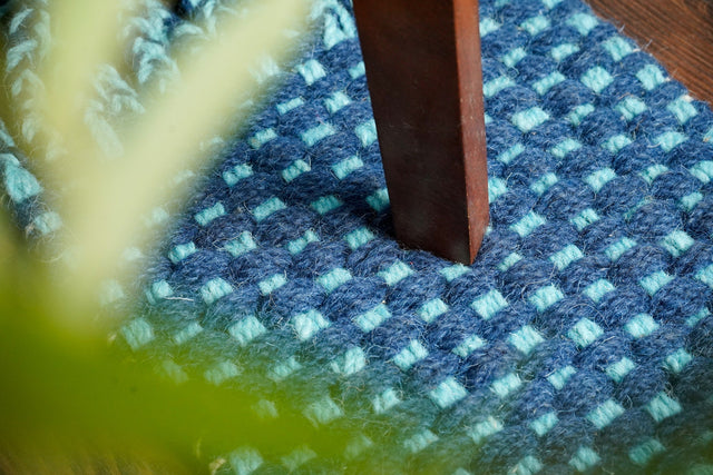 Blue chunky looped wool rug flat view