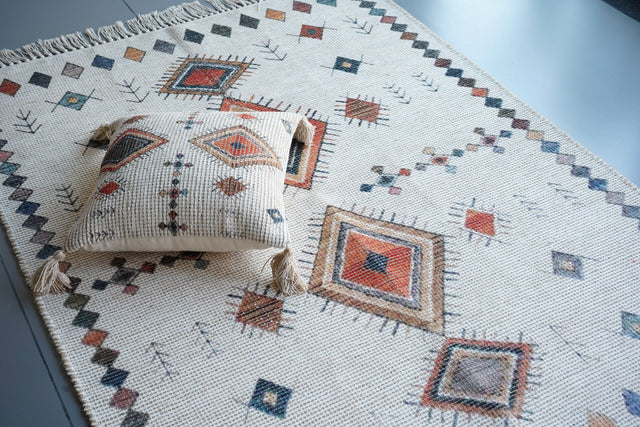 Ivory Moroccan print rug laid flat showing full pattern