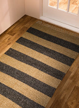 Charcoal and beige striped chunky wool rug styled in living room