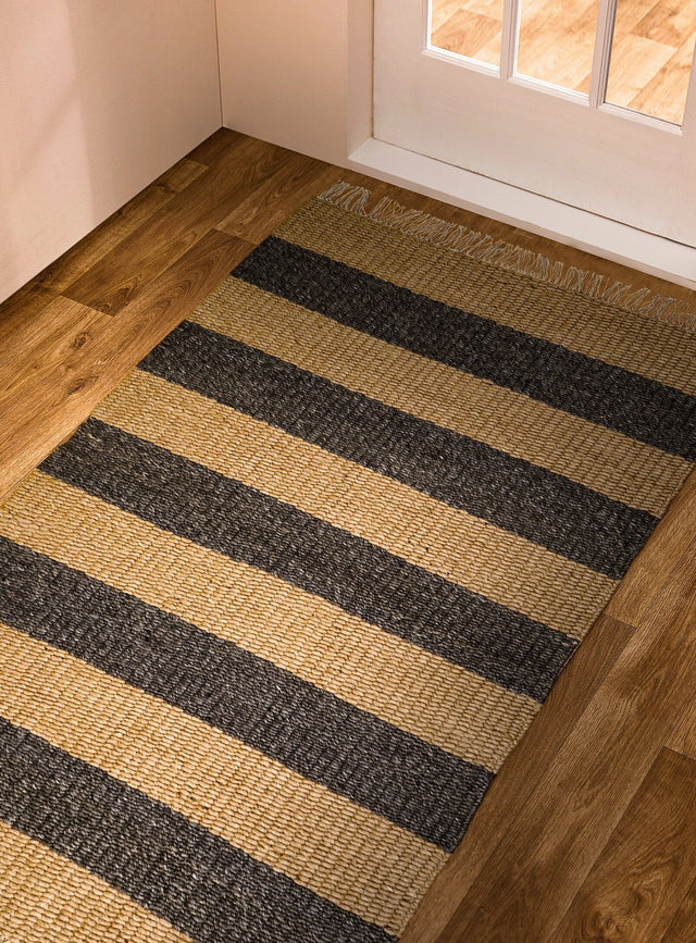 Charcoal and beige striped chunky wool rug styled in living room