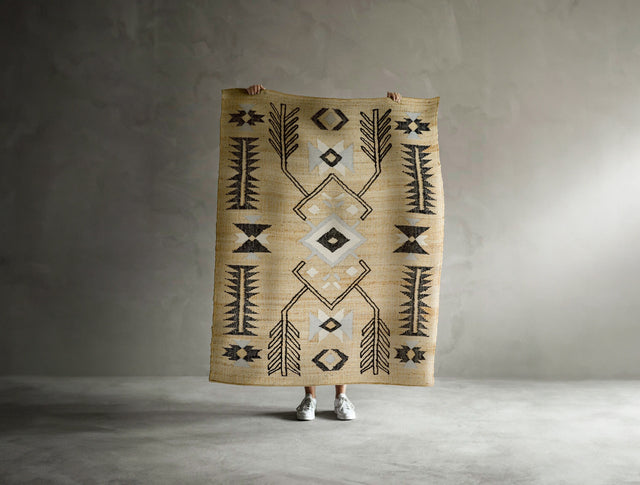 Jute geometric rug styled in a living room setting