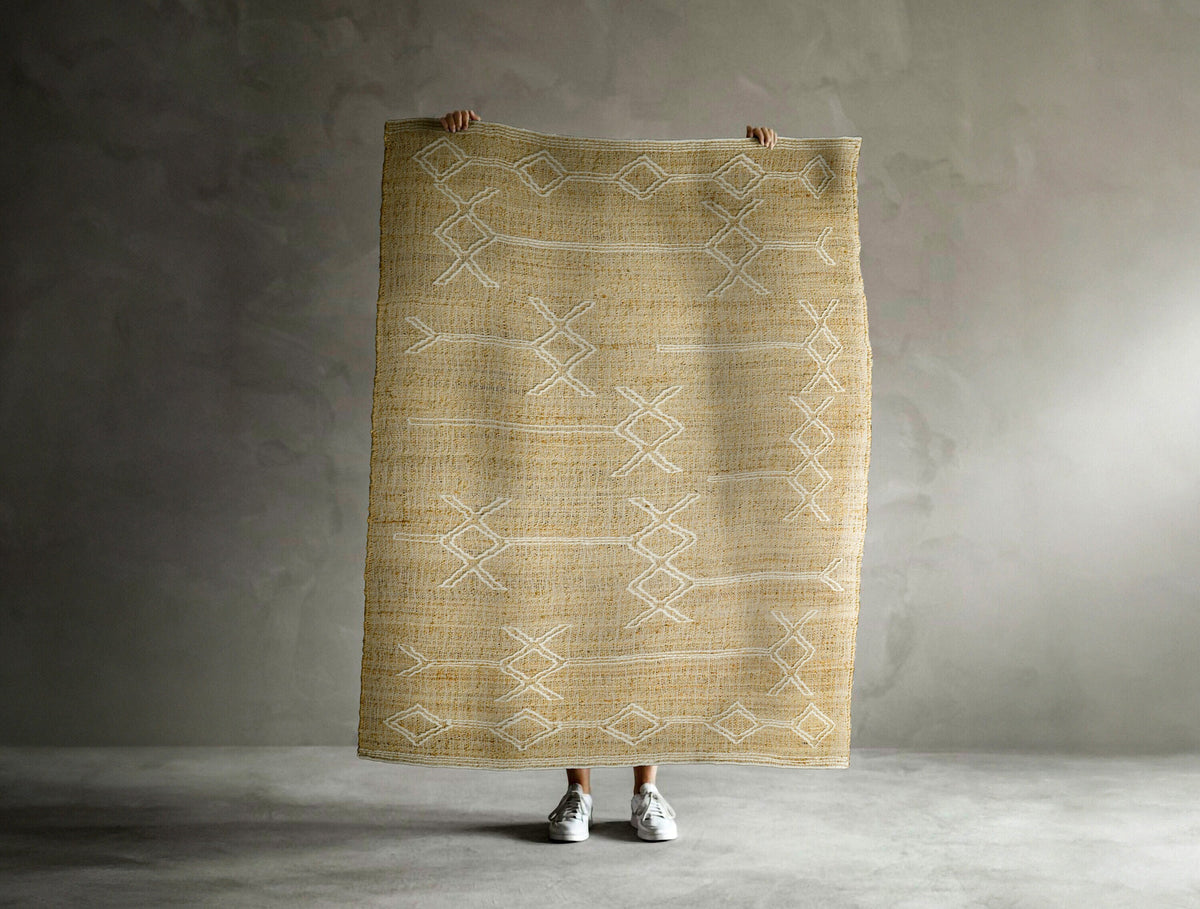 Ivory jute rug styled in a living room