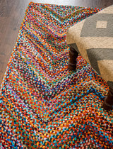 Colourful rag rug styled in a living room
