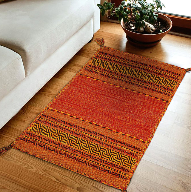 Vibrant orange kilim rug flat lay full view