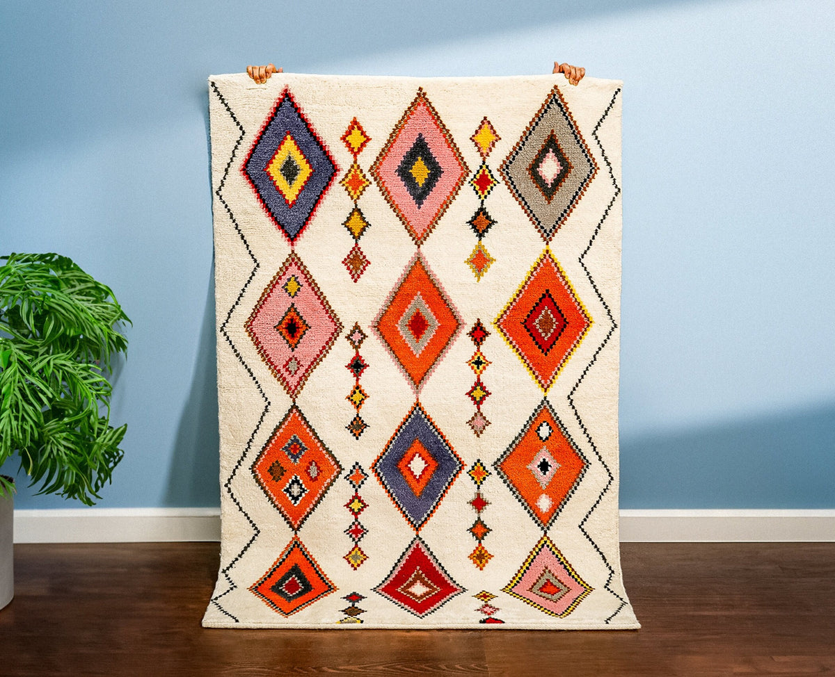 Colourful rug styled with boho furniture