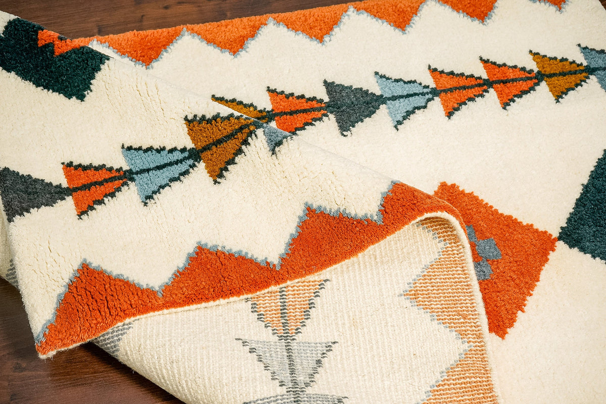 Multicolor rug corner detail with fringe edge