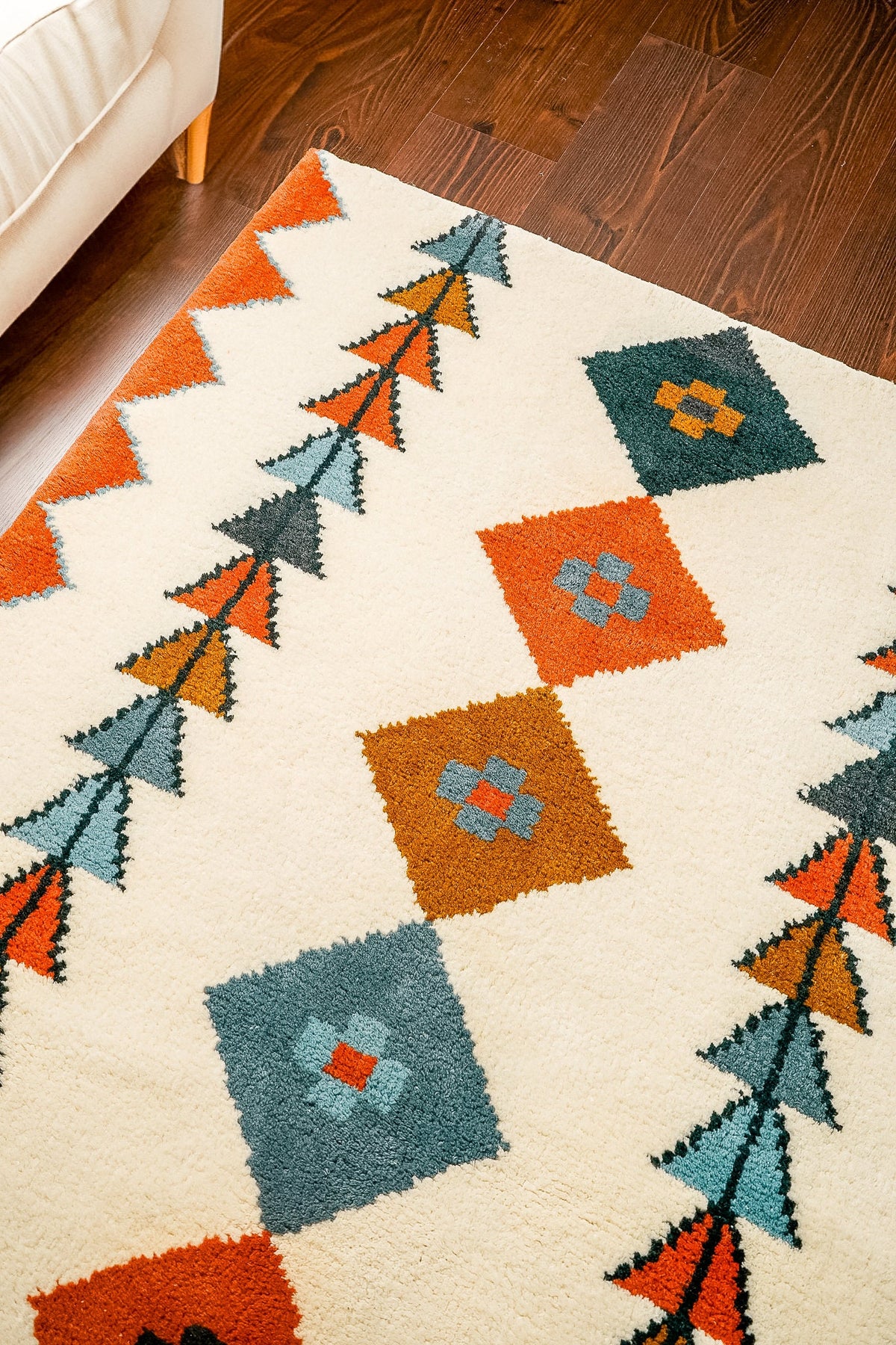 Wide shot of multicolor Moroccan rug in a bright room