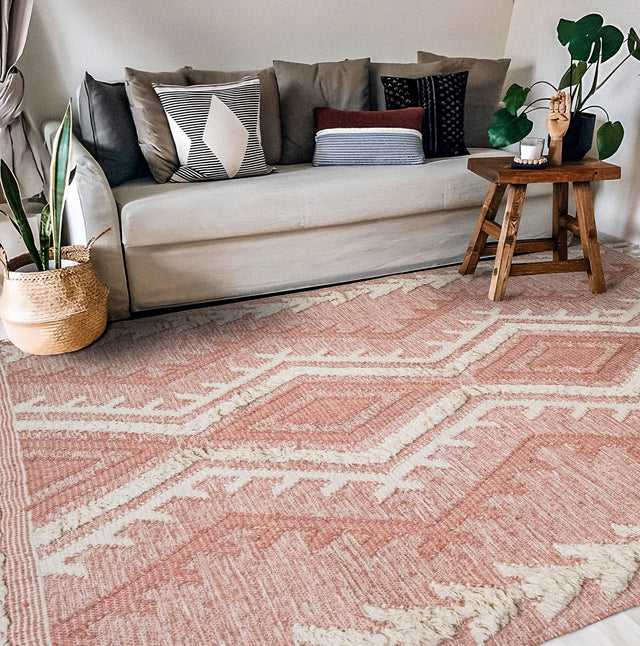 Blush pink shag rug styled in a bedroom