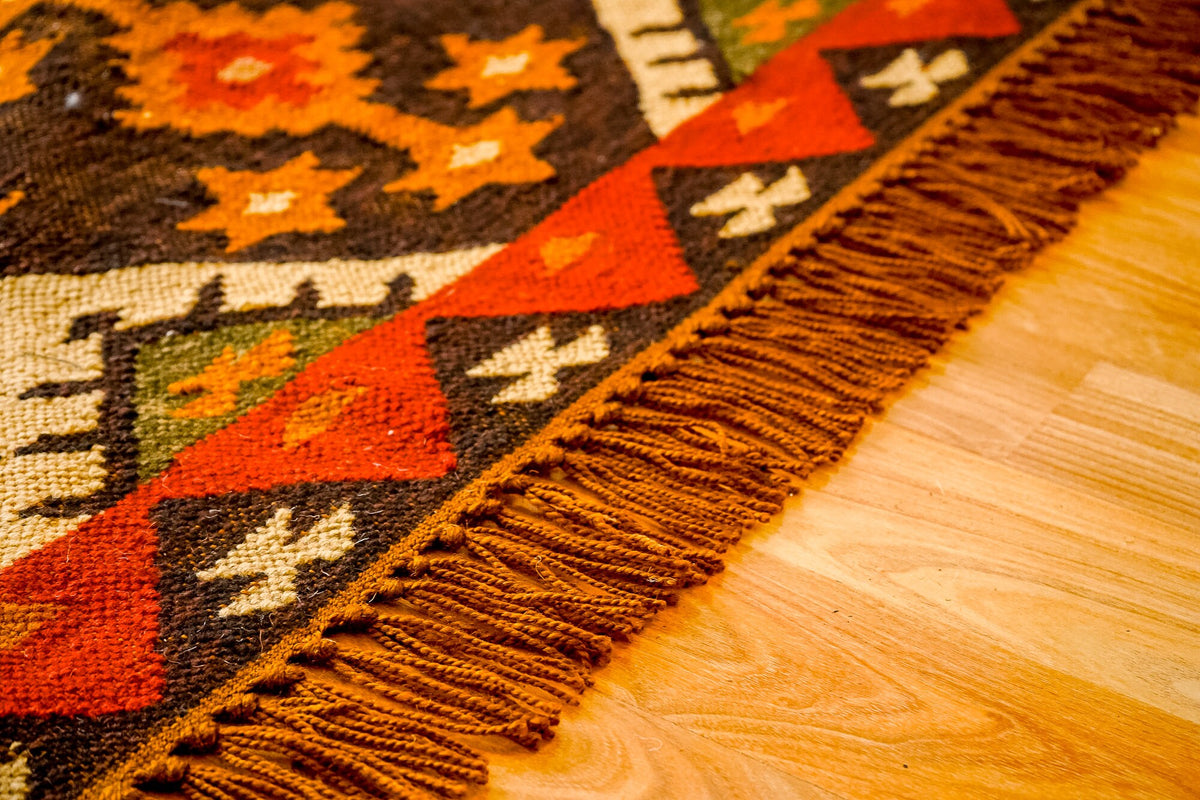 Southwestern kilim rug laid in an entryway