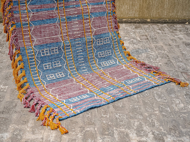 Blue-purple tribal kilim rug flat lay showing full pattern