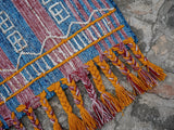 Kilim area rug shown at an angle in room decor