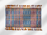 Close-up of kilim rug fringe and braided edge detail