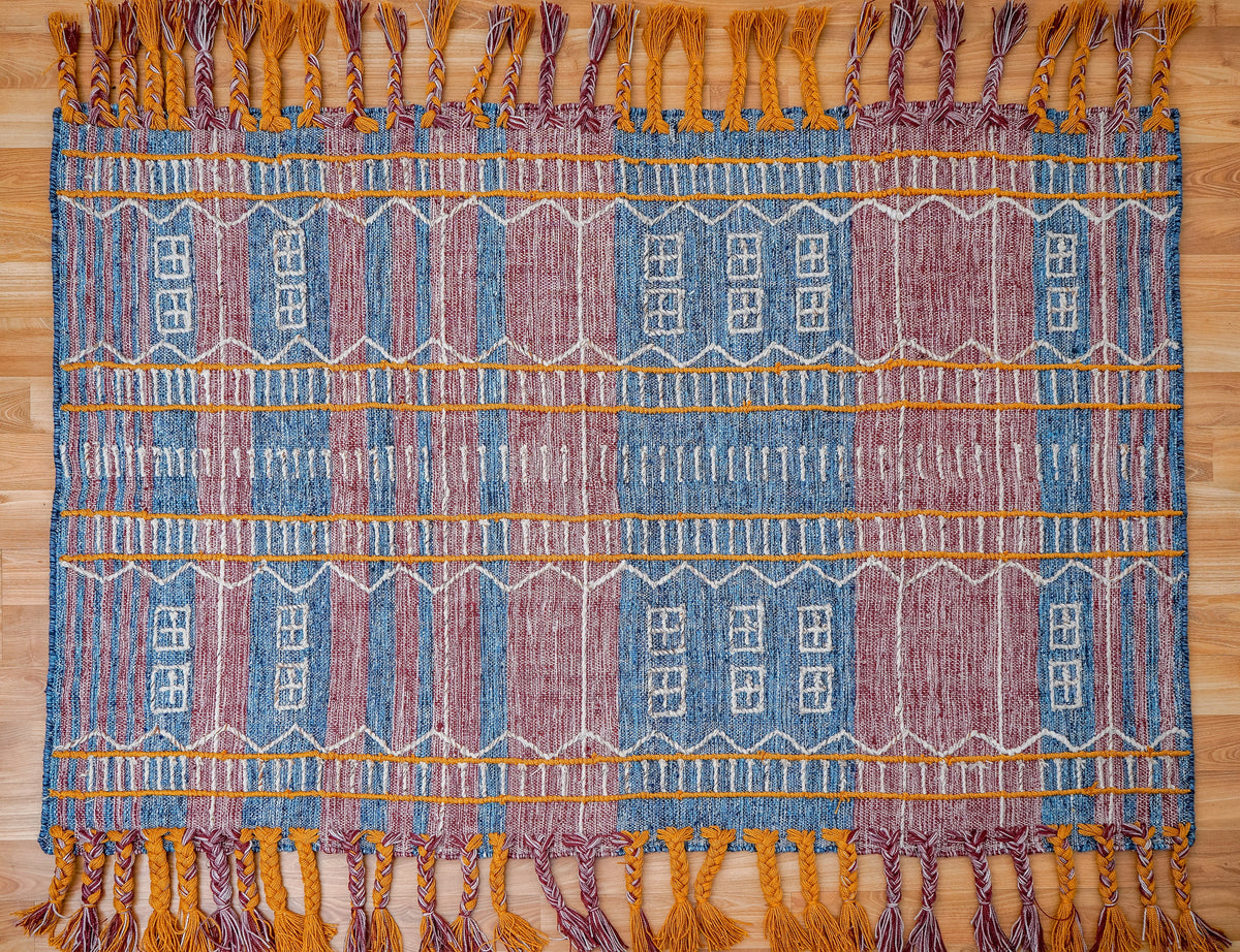 Blue-purple tribal rug corner view showing weave texture