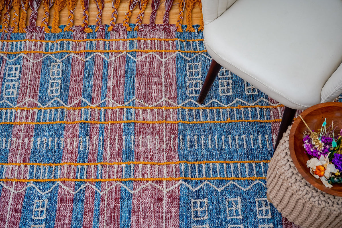 Blue-purple rug texture close-up showing yarn weave