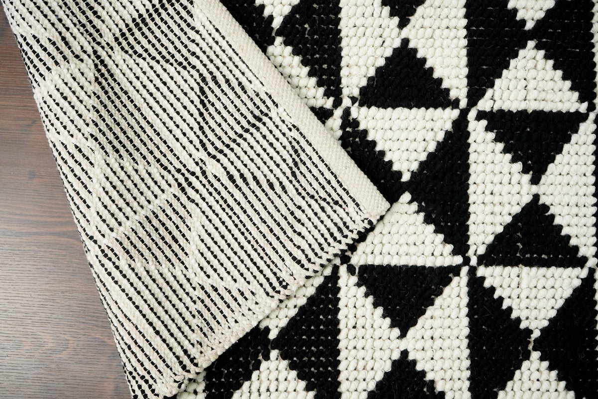 Checkered wool rug in a bedroom setting