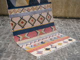 Pastel Moroccan rug fringe detail close-up