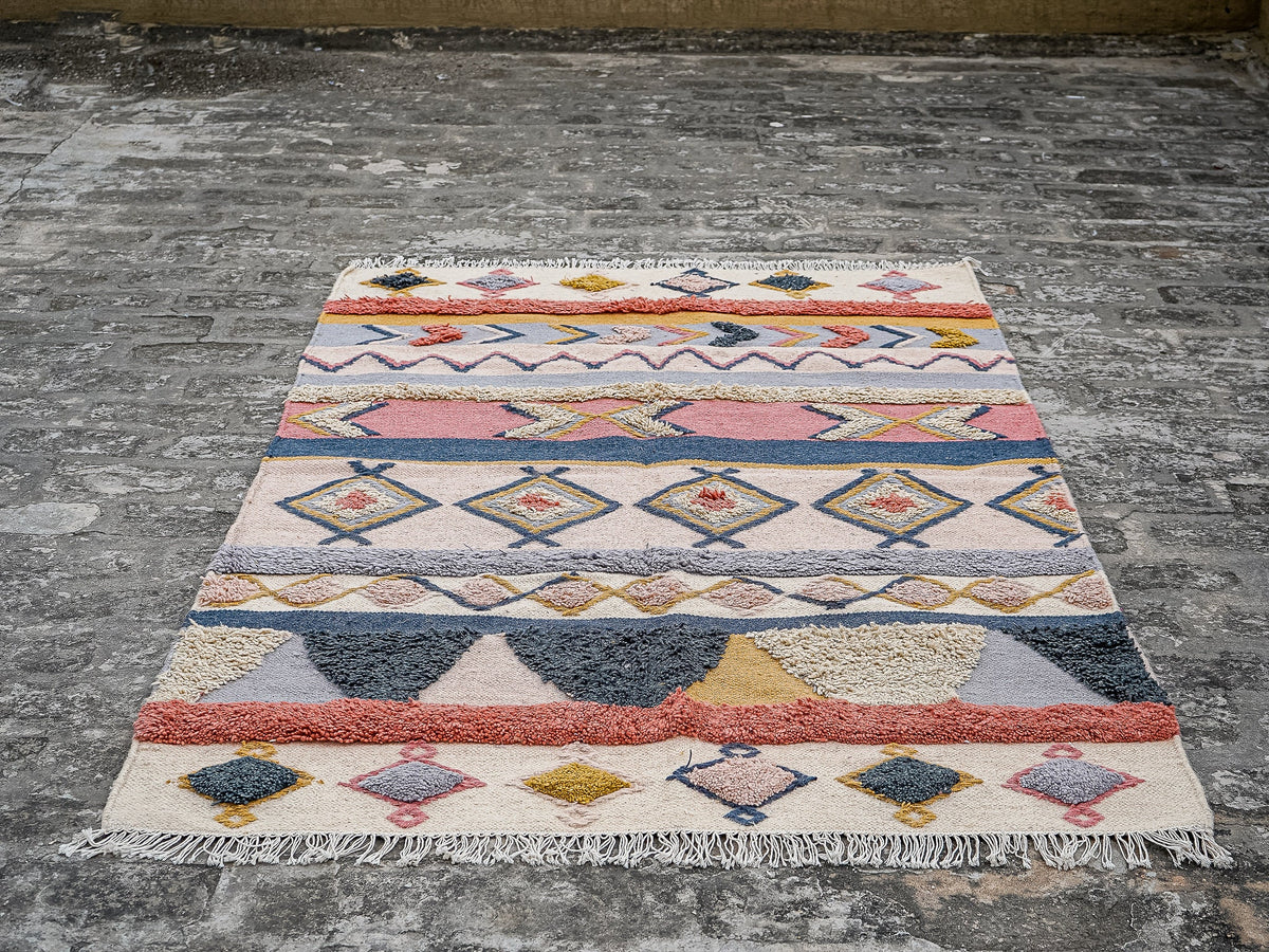 Handwoven pastel Moroccan rug texture close-up