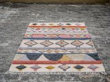 Handwoven pastel Moroccan rug texture close-up