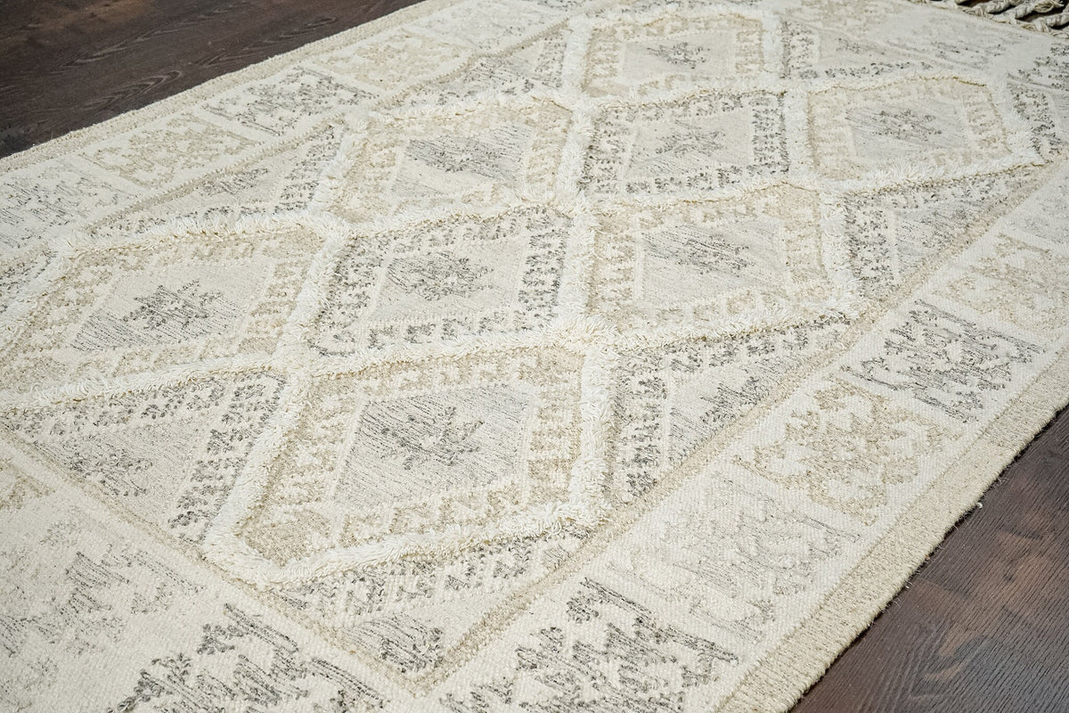 White kilim rug styled with neutral furniture