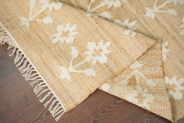 Jute flower rug styled in a bohemian living room