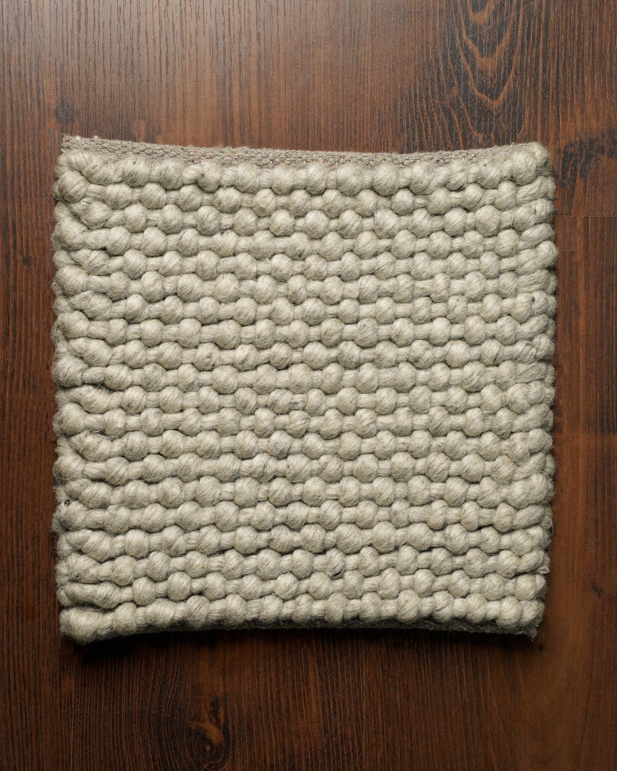 Handwoven grey chunky loop wool rug, flat lay view