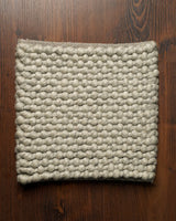 Handwoven grey chunky loop wool rug, flat lay view