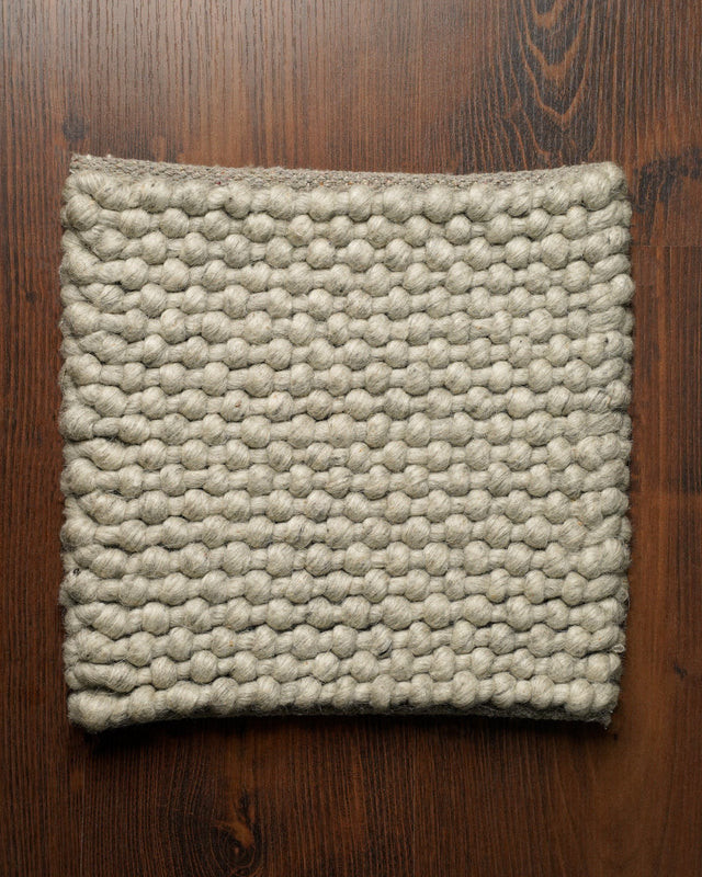 Handwoven grey chunky loop wool rug, flat lay view