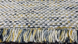Wool rug corner view showing multi blend colors