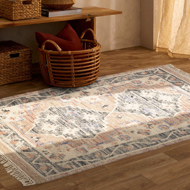 Pink vintage kilim rug laid flat showing full pattern