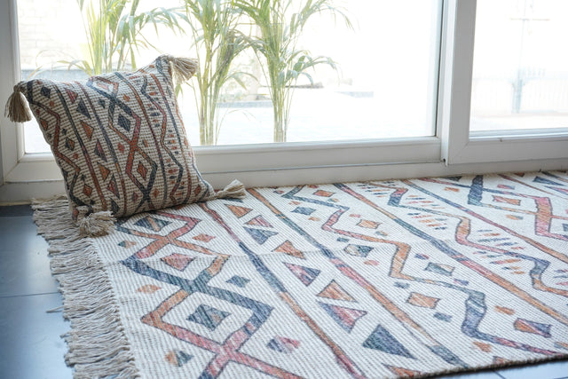 Striped Moroccan ivory rug laid flat showing full pattern