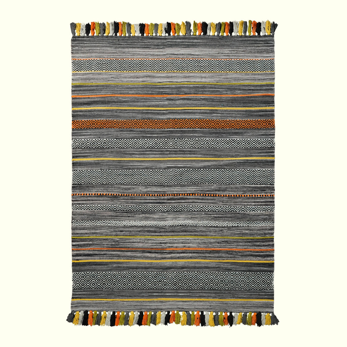 Grey striped rug styled in a bedroom