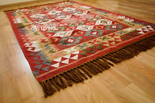Red traditional kilim rug styled on patio