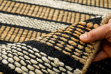 White striped jute rug in bedroom setting