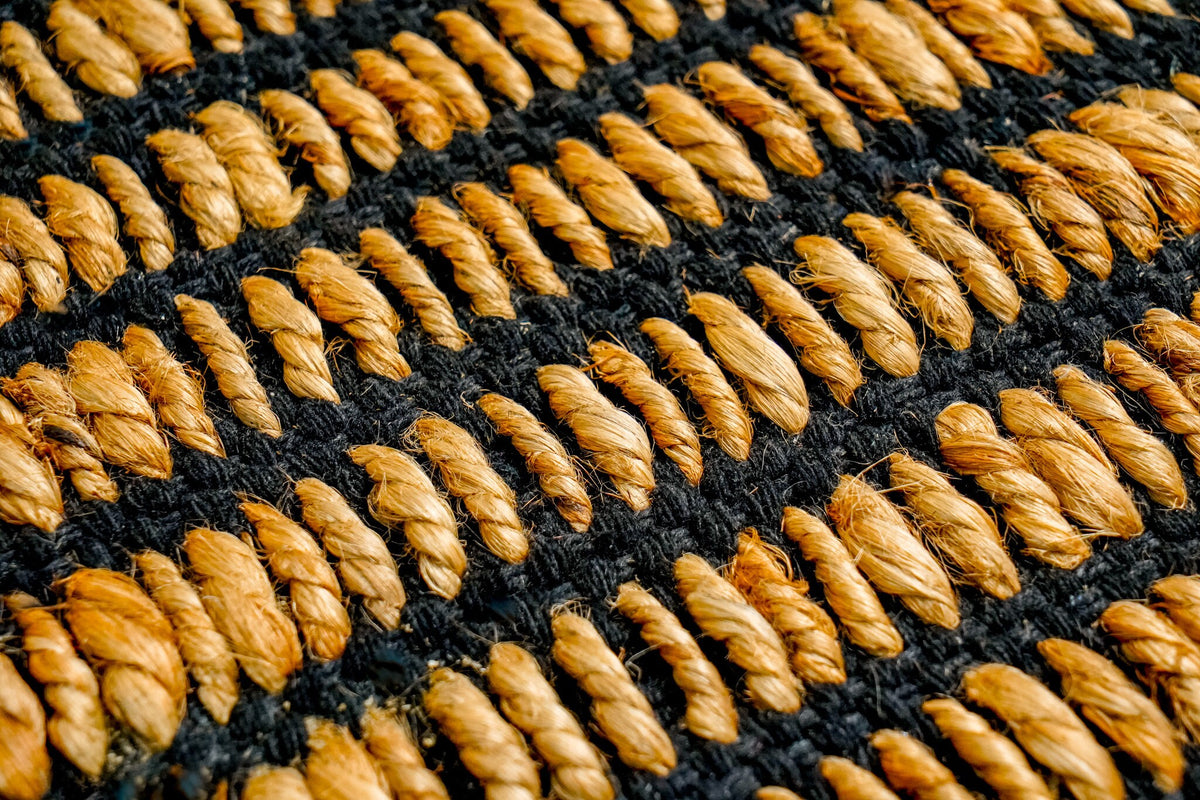Black ribbed jute rug full size overhead view