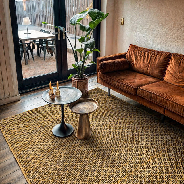 Honeycomb jute rug styled in a living room