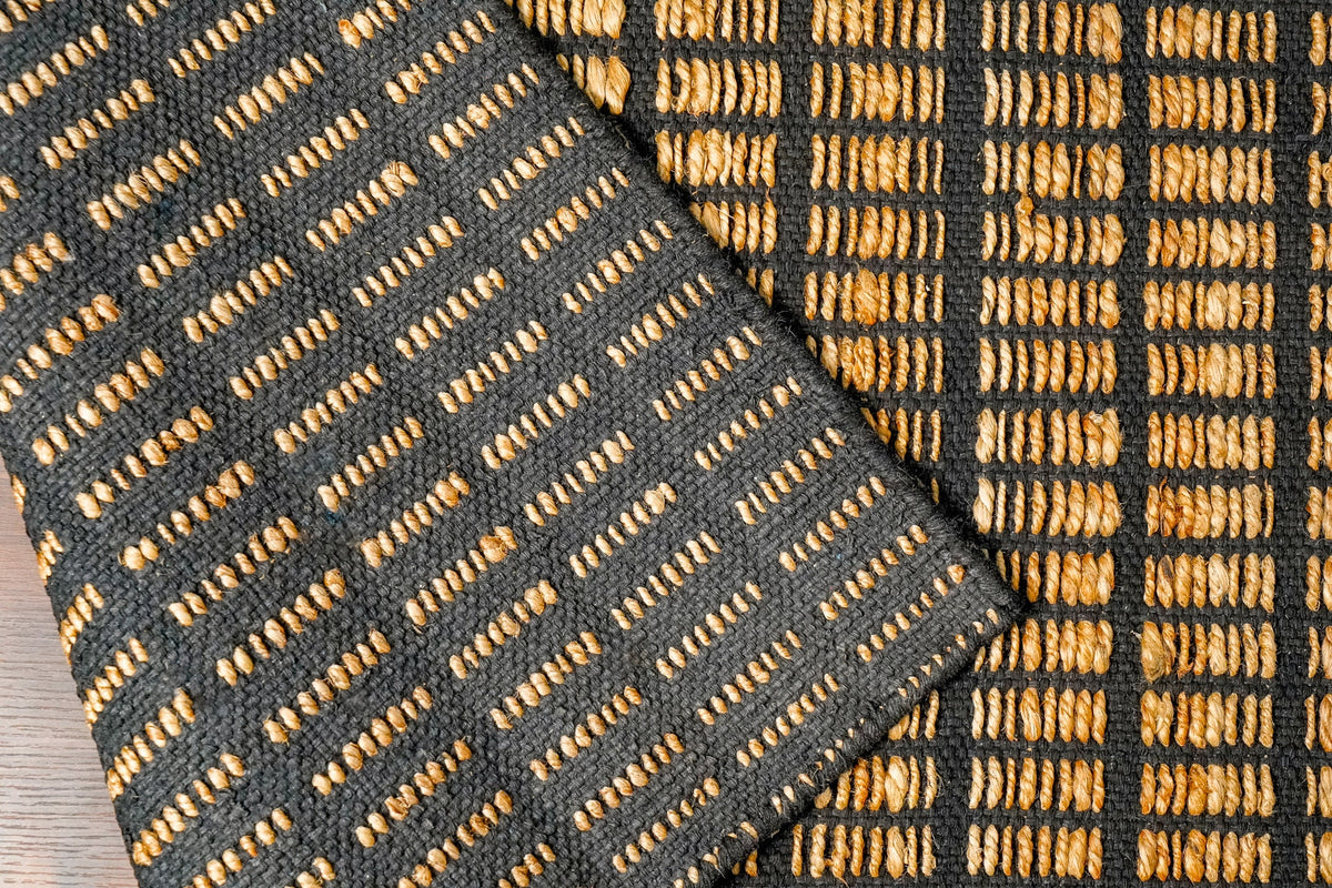 Handwoven jute rug styled with furniture in room